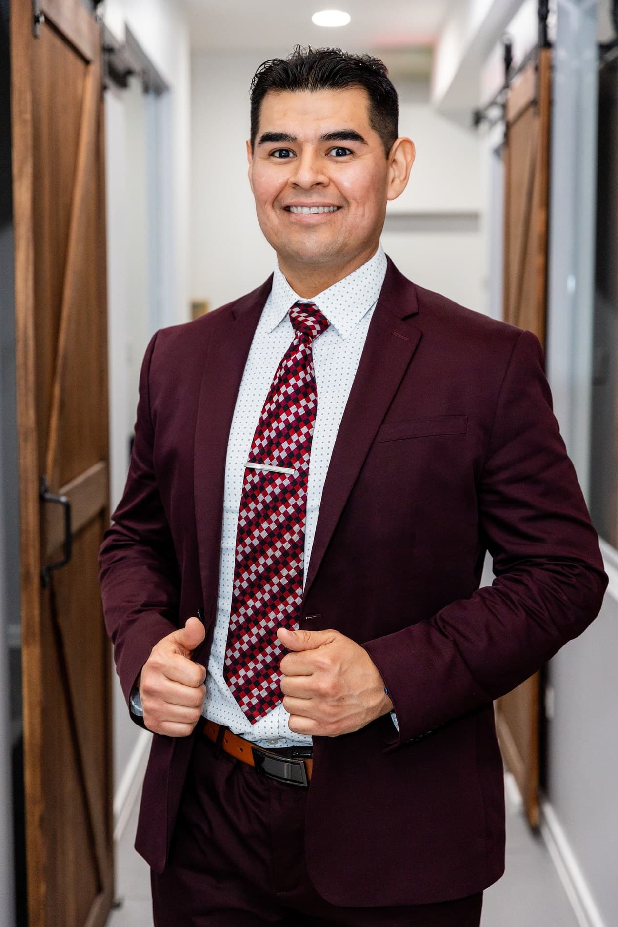 Baltazar Nunez standing in a suit